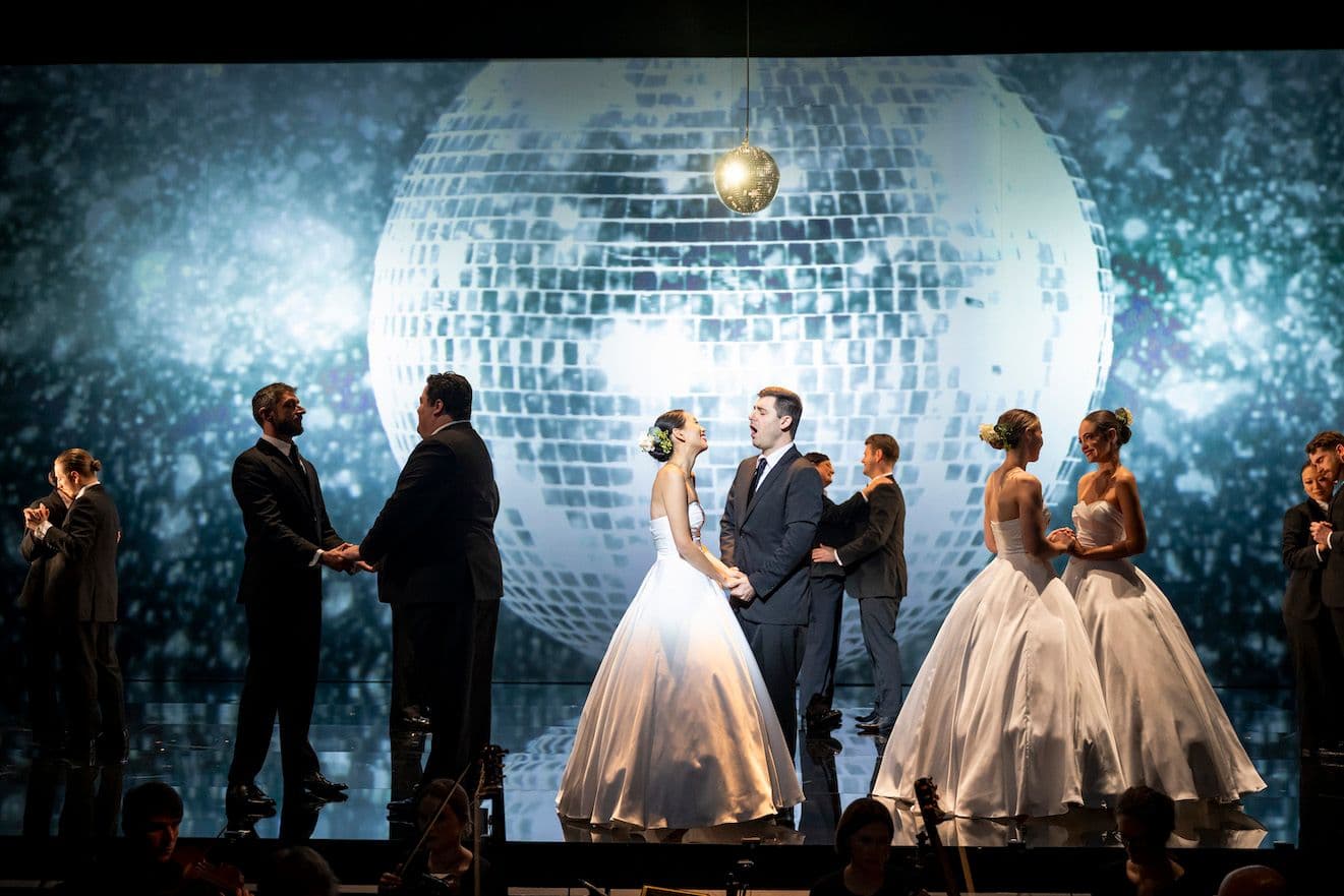 Wedding scene from Pinchgut's production of The Fairy Queen with large mirror ball projected