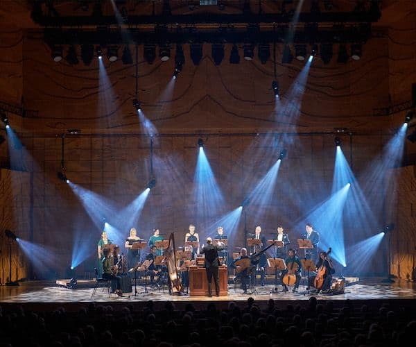 Orchestra performing on stage at the City Recital Hall