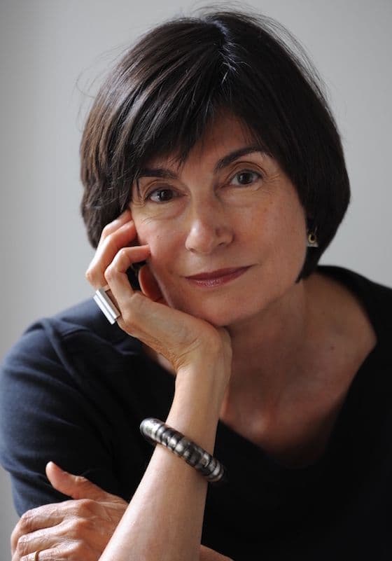Headshot of Virgina Braden, a woman with dark brown hair, relaxed with head in her hand